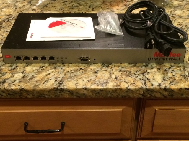 One firewall. Check. One ethernet cable. Check.  One power cord. Check.  One "rack mount kit" (aka "bag of screws") Check.